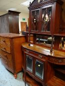 EDWARDIAN STAINED WALNUT PARLOUR CABINET and an Edwardian bowfront chest of drawers (2)