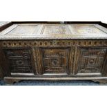 18TH CENTURY JOINED OAK COFFER, later carved with rosettes and foliate uprights, later bracket feet,