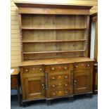 19TH CENTURY ANGLESEY WELSH DRESSER, the base with flanking cupboards and six drawers, on bracket