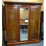 VICTORIAN MAHOGANY TRIPLE WARDROBE, arched panel doors and replaced mirror centre, 178cms wide x