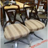 STYLISH PAIR OF MID-CENTURY SWIVEL CHAIRS with cushioned seats, chrome, spider supports and hollowed