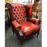 VINTAGE BUTTONED RED LEATHER WING-BACK ARM CHAIR Condition Report: arms and back worn leather.