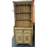 PINE NARROW DRESSER having a base of two drawers and a two-door cupboard, open rack, 86 x 42 x