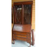 VINTAGE MAHOGANY BUREAU BOOKCASE on ball and claw supports with three drawers and astragal glazed