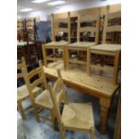 FARMHOUSE PINE KITCHEN TABLE with six matching rush seated, ladder back chairs