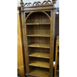 REPRODUCTION GOTHIC-STYLE OPEN BOOKCASE with carved supports and carved finials