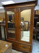 EDWARDIAN MAHOGANY CARVED DOUBLE WARDROBE with two mirrors and base drawer