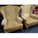 PAIR OF REPRODUCTION GEORGIAN-STYLE WING-BACK ARMCHAIRS on carved ball and claw supports, caramel