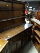 REPRODUCTION OAK SMALL DRESSER & AN EDWARDIAN LEAD GLAZED OAK BOOKCASE (2)