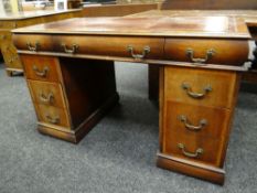 REPRODUCTION MAHOGANY WRITING DESK, two banks of three drawers, three further frieze drawers, gilt