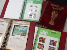 FOUR FIFA 1974 WORLD CUP MASTERFILE STAMP ALBUMS containing first day covers, stamps and