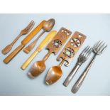 LOVE SPOONS & CUTLERY carved in sycamore and other woods, the love spoons dated 1901 and 1904