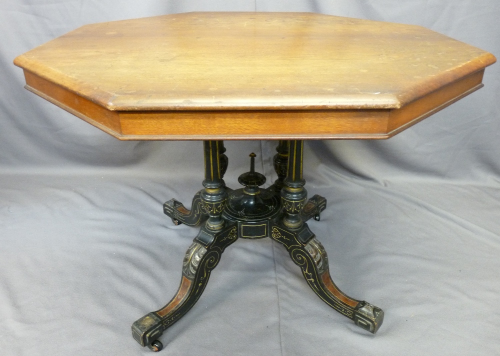 OCTAGONAL TOP VICTORIAN TABLE on fancy gilt highlighted four-column four-footed ebonized and