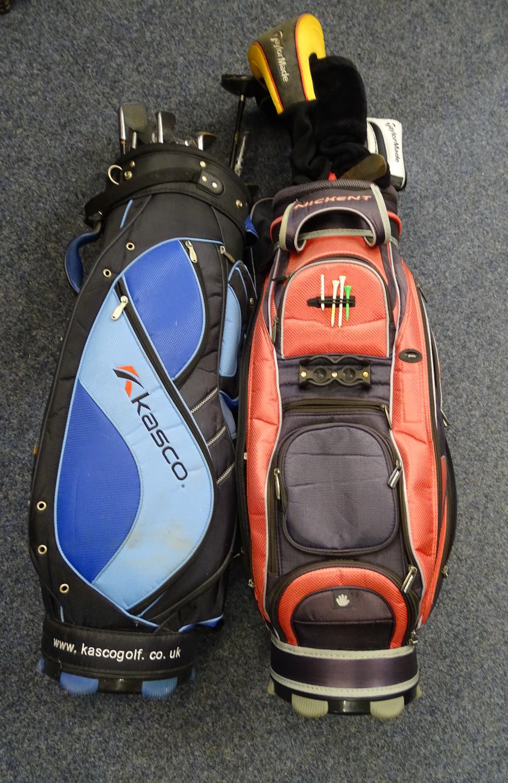 TWO SETS OF GOLF CLUBS IN CADDY BAGS