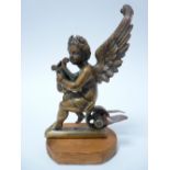 VINTAGE CAR MASCOT- WINGED CHERUB WITH LYRE seated on a wheel, possibly mounted as a mascot, LOZENGE