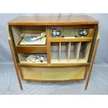VINTAGE BUSH RADIOGRAM & RECORD DECK in two-door walnut cabinet, having record and other storage