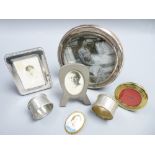 SILVER CIRCULAR PHOTO FRAME, three others, two napkin rings and a Limoges porcelain brooch