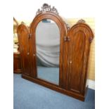VICTORIAN MAHOGANY TRIPLE WARDROBE three-section arched tops with carved mounts above a large