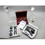 TWO MODERN GLASS DECANTERS & THREE CASED SETS OF WINE & CHAMPAGNE CORKING TOOLS, STOPPERS