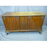REPRODUCTION MAHOGANY LOW SIDEBOARD with applied carving, on ball and claw feet (ex-entertainment