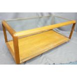 MID-CENTURY G-PLAN STYLE TEAK GLASS TOP COFFEE TABLE with under tier shelf on chrome castors,