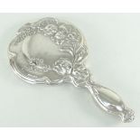 ART NOUVEAU SILVER HAND MIRROR with raised floral decoration, London 1906 Condition Report: small