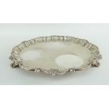 VICTORIAN SILVER SALVER with applied shell and scroll border, raised over three scroll shell feet,
