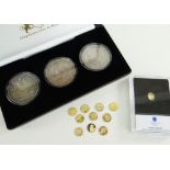 ELEVEN MINIATURE GOLD COINS believed all 585, 0.5gms, together with cased set of three Queen