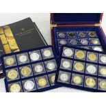 THE MILLIONAIRES COLLECTION COINAGE SET displayed on three trays in a mahogany box and being set