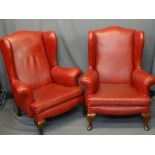 VINTAGE WINGBACK ARMCHAIRS, a pair, in red leather effect