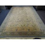 EASTERN STYLE TASSEL ENDED CARPET, traditional patters on a green and cream ground, 350 x 240cms