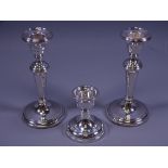 SILVER CANDLEHOLDERS, a pair on circular bases with tapered plain columns, Birmingham 1984/9 (