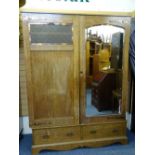 ARTS & CRAFTS STYLE TWO DOOR OAK WARDROBE, mirrored to one door with copper type strap hinges and