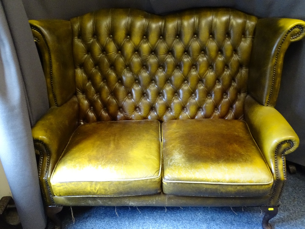 VINTAGE BUTTON UPHOLSTERED WING BACK TWO SEATER SETTEE, green leather effect with studded detail,