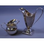 TWO SILVER CREAM JUGS, one square based, helmet shaped, 3 ozs, London 1809 and a small bowl shaped