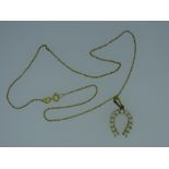 CONTINENTAL GOLD & SEED PEARL HORSESHOE PENDANT on a 9ct gold fine link necklace, import marks, 3.