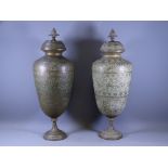 EASTERN BRASS URNS & COVERS, a pair, with cone finial caps decorated with birds, animal and people