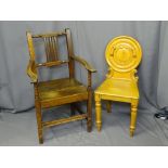 TWO ANTIQUE OAK CHAIRS including a farmhouse armchair and a circular back Victorian hall chair,