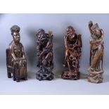 FOUR EASTERN & AFRICAN CARVED WOODEN FIGURINES to include an African noble woman seated on a