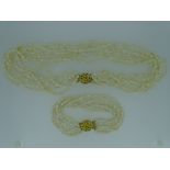 TWO FRESHWATER PEARL FOUR STRAND NECKLACES, 49grms and 21grms, in a Boodle & Dunthorne box
