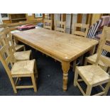 LARGE PITCH PINE DINING TABLE, 213 x 106cms and set of eight Arts & Crafts-style beech rush seated