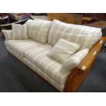 MODERN HARDWOOD & DOUBLE CANED SETTEE with over scrolled arms and loose regency stripe upholstery,