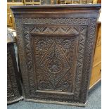 18TH CENTURY CARVED OAK HANGING CORNER CUPBOARD, 80cms high