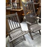 TWO H. CASTLE & SONS FOLDING TEAK GARDEN CHAIRS, made from reclaimed naval timber, one with