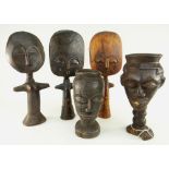 TWO KUBA PALM WINE CUPS carved with faces, tallest 25.5cms; and three souvenir Ashanti dolls,