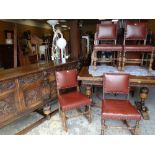JACOBEAN-STYLE OAK DINING SUITE comprising carved draw leaf table, four red leather upholstered