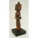 FANG RELIQUARY GUARDIAN FIGURE with three faces, 51cms high