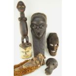FIVE VARIOUS AFRICAN MASKS including Pende, Tanzanian four faced mask, Dan Simian mask (damaged),