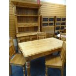 CARVED PINE DINING SUITE comprising table, 153cms long, four chairs and high dresser, 126cms wide (