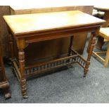LATE VICTORIAN MAHOGANY FOLDOVER CARD TABLE, square top on turned legs, with baluster spindle